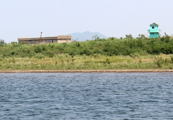 中朝边境美丽的风景,中朝边境桃花盛开的地方