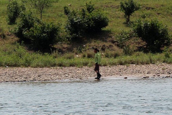 中朝边境美丽的风景,中朝边境桃花盛开的地方
