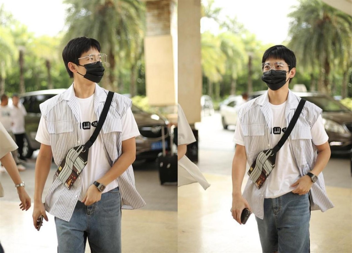 齐刘海短发男杨洋,杨洋穿的黑色马甲搭配黑色衬衣