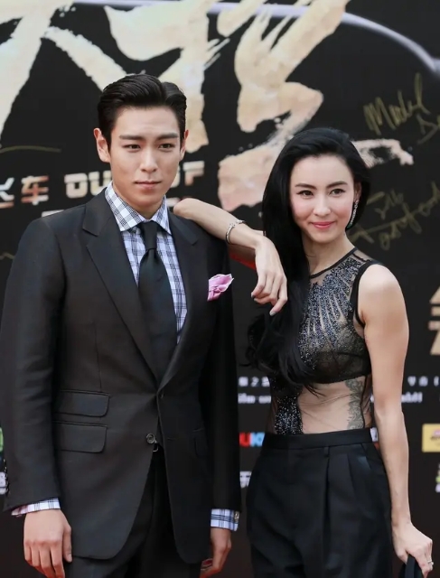 张柏芝露脐装搭配热裤,张柏芝橘色卫衣哈伦裤机场时尚感