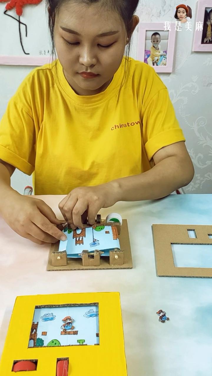 一个快递盒做了一个玩具,一个纸箱做一个游戏机