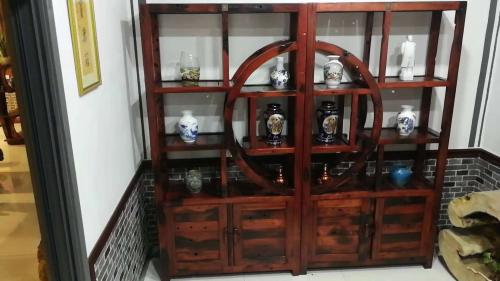 佛山木饰面板酒店装修效果图,木饰面板酒店民宿装修效果图