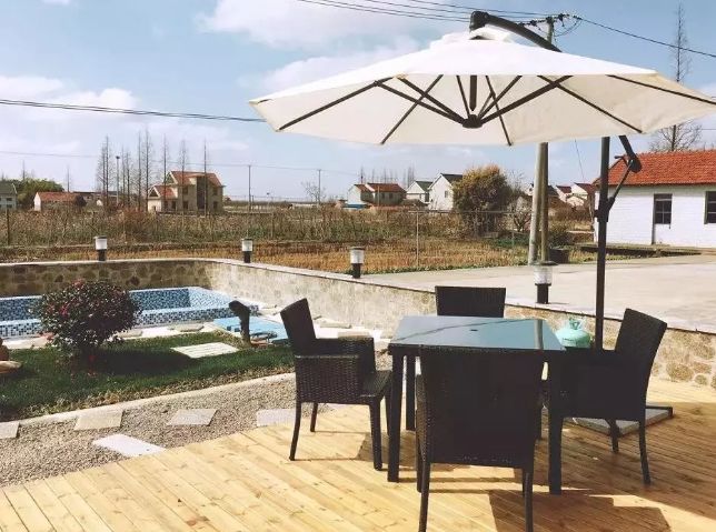 上海市崇明南来北往精品民宿,崇明恬园居民宿和风小木屋团购