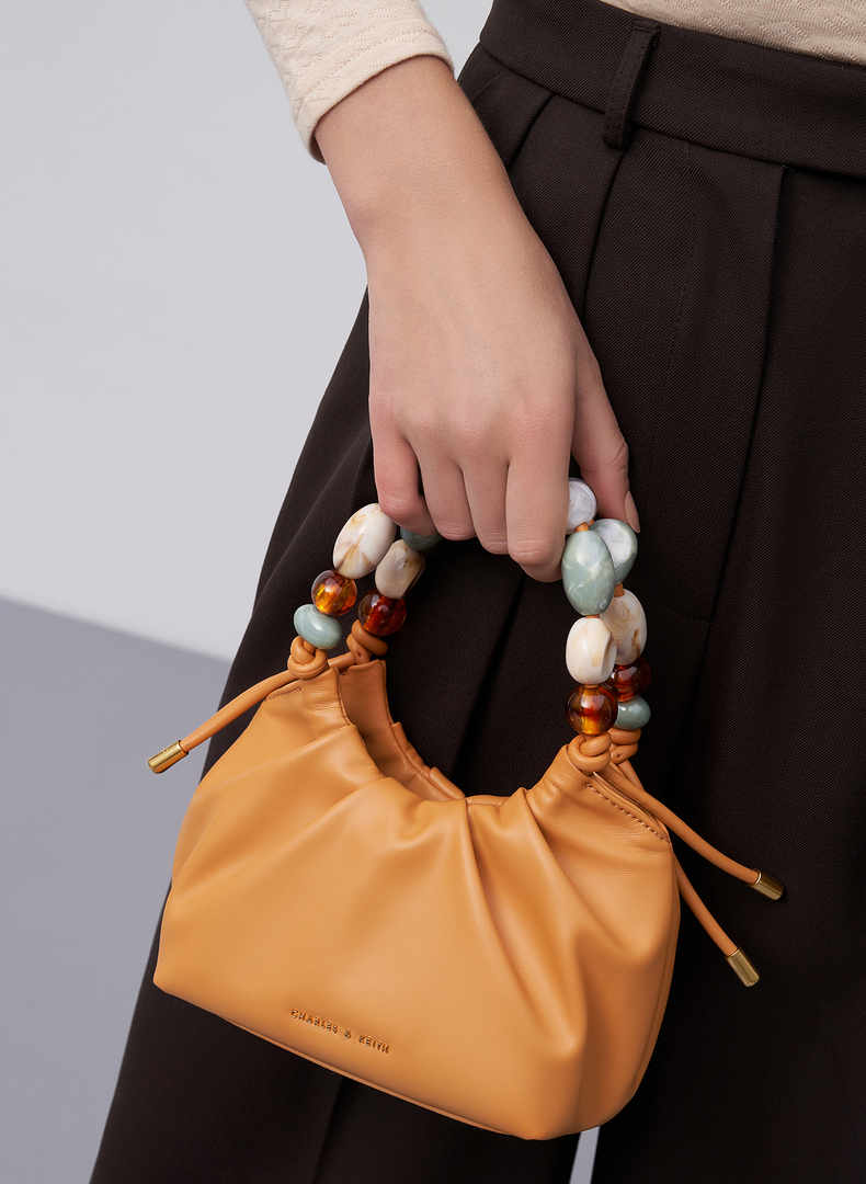 40到50岁女人适合背什么包包,40岁女性背什么牌子的包包