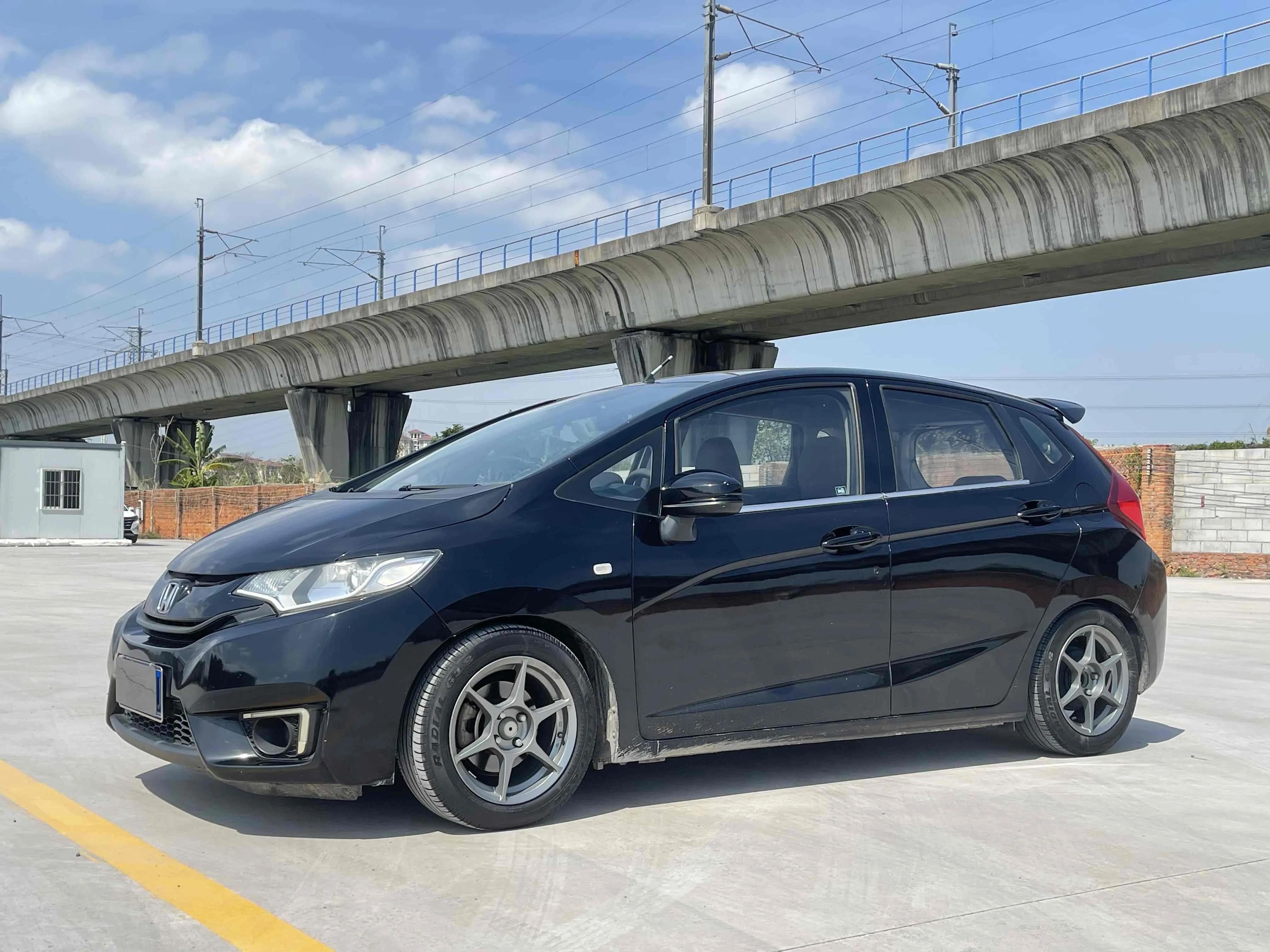 飞度2014款1.5cvtexli领先版价格,本田飞度09款1.3l图片