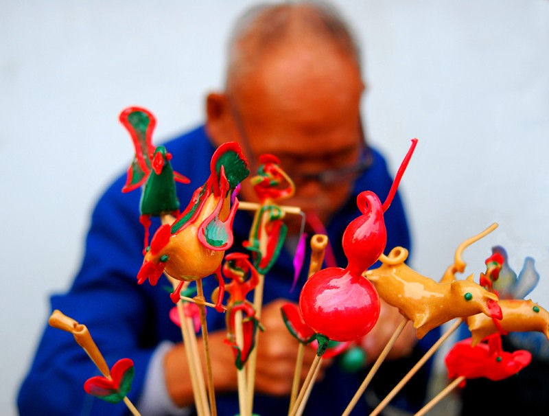 民间艺术吹糖人的发明者 (吹糖人是中国民间传统艺术吗)